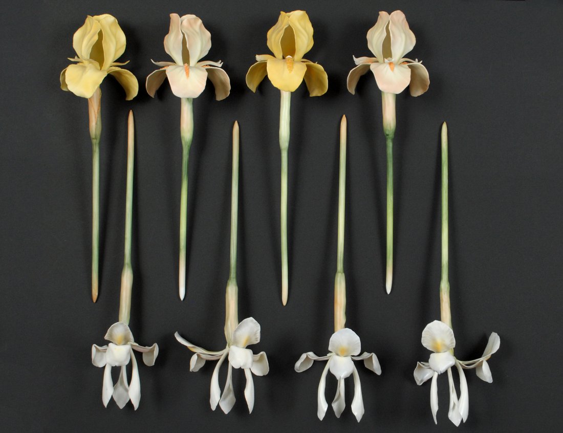SET OF FOUR PORCELAIN WHITE IRIS: English. Circa 1970. By Royal Worcester. Approximate length 12 1/2". Together with four daffodils. Approximate length 12". (8 pcs) (100/500)