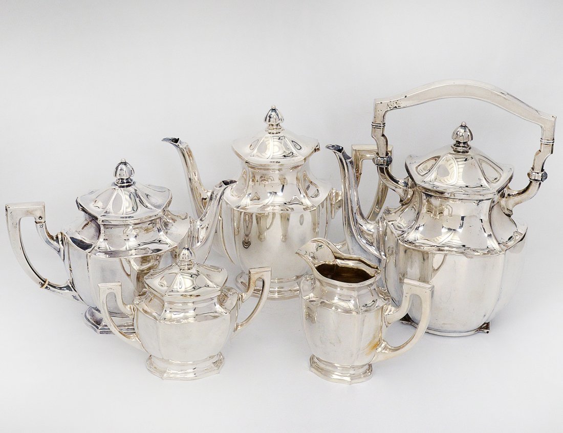 FIVE PIECE CONTINENTAL SILVER TEA AND COFFEE SERVICE: Italian. (.800 Fine) Comprising: tilting kettle (no stand), tea pot, coffee pot, covered sugar bowl and creamer. (97 oz) (2000/3000)