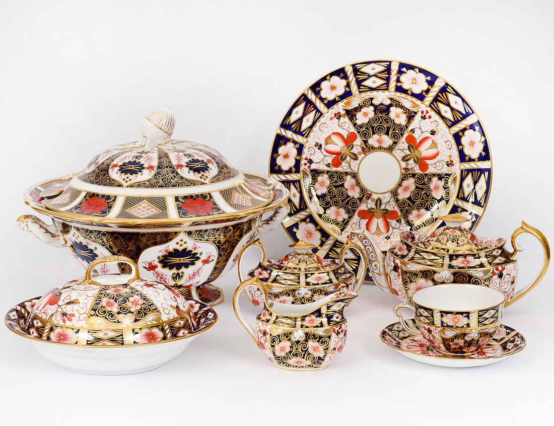THIRTY-EIGHT PIECE ASSEMBLED ROYAL CROWN DERBY: English. 20th Century. In the â€œ2451 and 1128â€ patterns. Comprising: ten dinner plates, eleven cups and saucers, teapot, covered sugar bowl, creamer, tureen and cover and breakfast dish and c