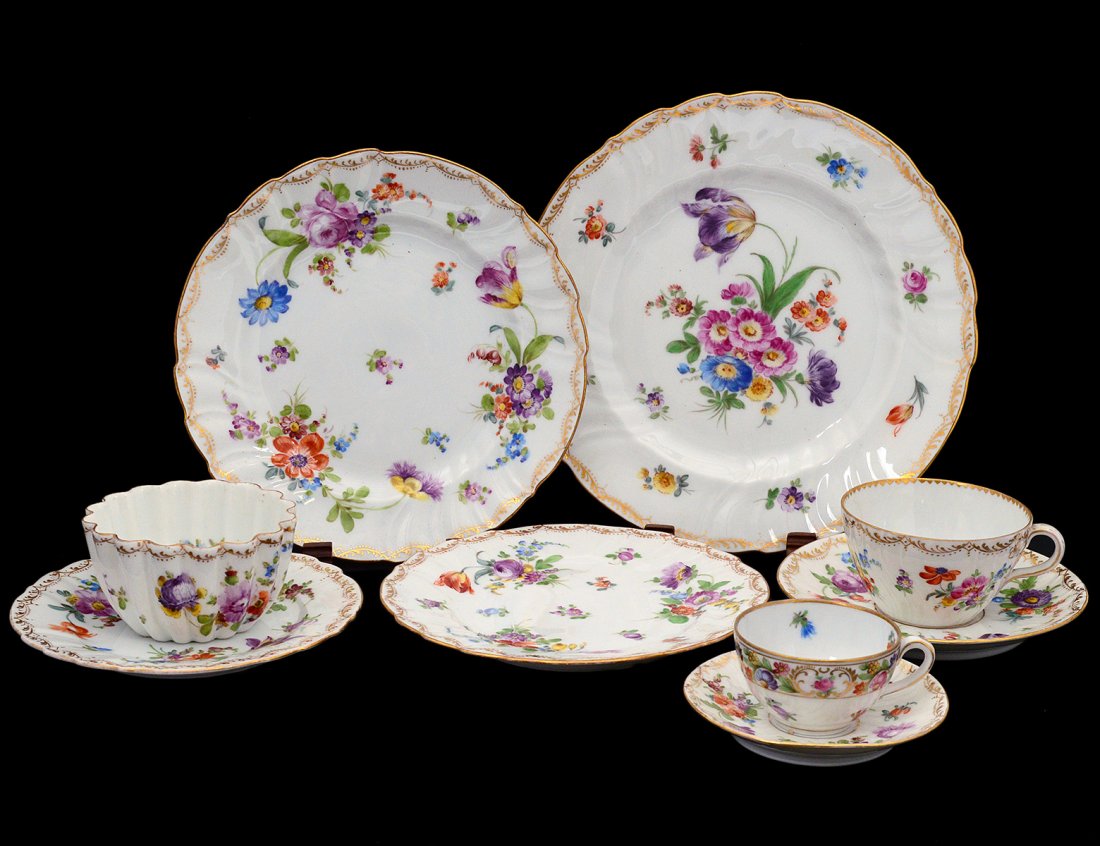 FIFTY-EIGHT PIECE DRESDEN PORCELAIN PART DINNER SERVICE: German. 20th Century. Comprising: eleven dinner plates, six luncheon plates, eleven salad plates, nine bread and butter plates, six cups and saucers, four demitasse cups and saucers and sugar bowl. (2