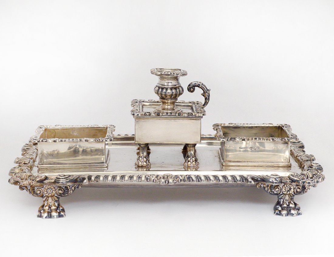 GEORGE III STERLING SILVER STANDISH: English. Sheffield. 1814. Maker: I&T.S. Of rectangular shape with gadroon and shell border, centered by a detachable chamber stick flanked by square wells and pen wells. Length 12â€. (40 oz) (Cond: