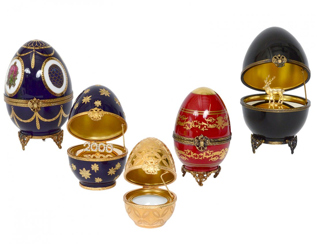GROUP OF FIVE LIMOGES PORCELAIN "FABERGE" EGGS: French. Various sizes and decorations. Two with silver gilt interior appointments. Heights 2 5/8" to 5 3/8". (300/400)