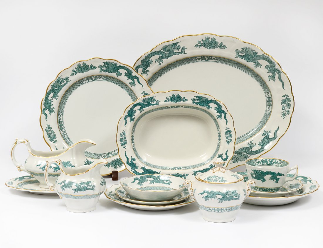 EIGHTY-FIVE PIECE BOOTHS IRONSTONE PART DINNER SERVICE: English. In the "Dragon" pattern. Comprising: twelve dinner plates, twelve soup plates, seven salad plates, twelve bread and butter plates, eleven berry bowls, twelve cups and saucers, two open vegeta