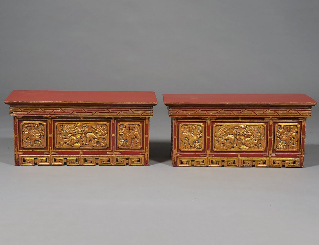 PAIR OF RED AND GOLD CARVED AND LACQUERED LOW ALTAR: Chinese. Each with pierced front and sides. Height 12 1/2". Width 27 3/4". Depth 12 5/8". (500/700)