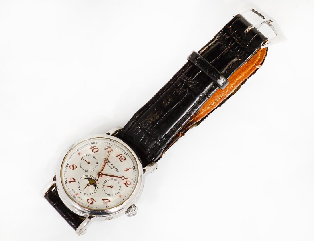 REPLICA PATEK PHILIPPE MEN'S WRISTWATCH: With spurious marks. With date, calendar and open back. (100/150)