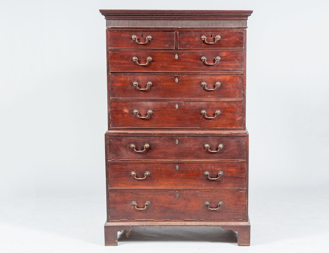 GEORGE III MAHOGANY CHEST ON CHEST: English. Circa 1800. In three parts. With detachable cornice. The top section with two short and three long drawers, the lower part with three long drawers. Height 69 1/2". Width 43 1/2". Depth 22 1/2