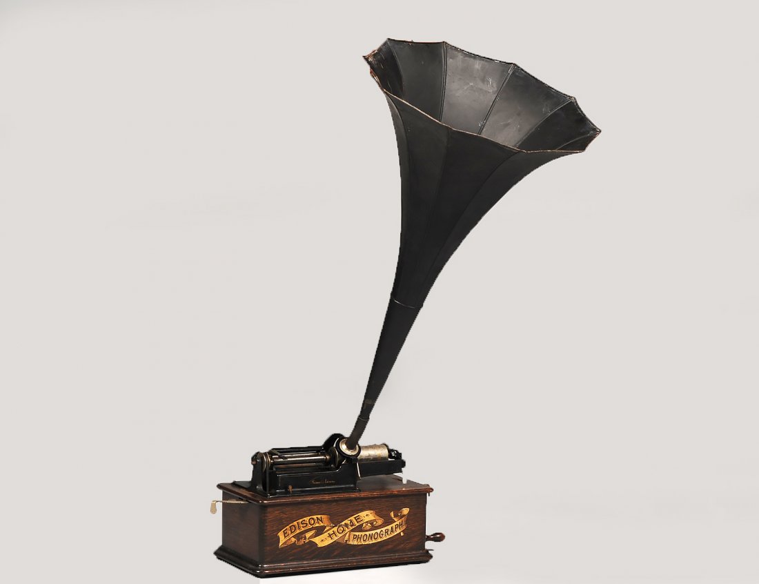 EDISON HOME PHONOGRAPH WITH HORN: 1890-1905. Serial No. H 190872. In oak case. Length 16". (400/600)