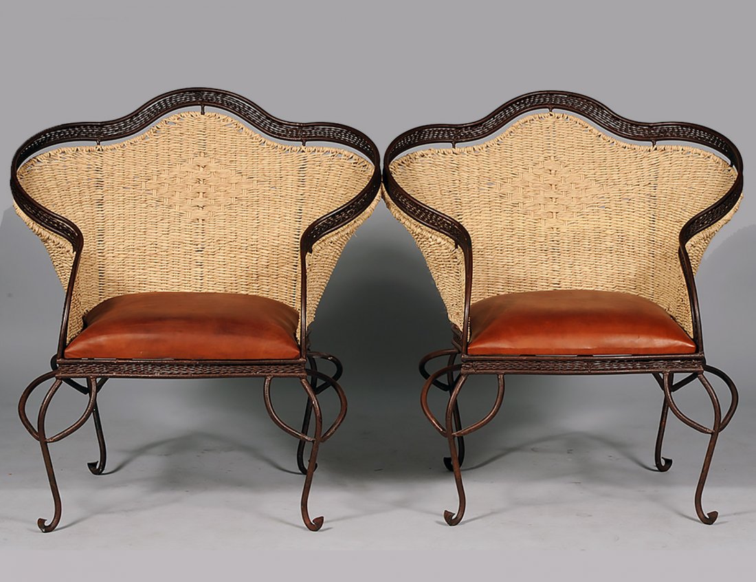 PAIR OF IRON AND RATTAN PATIO CHAIRS: Each with padded seat. (300/400)