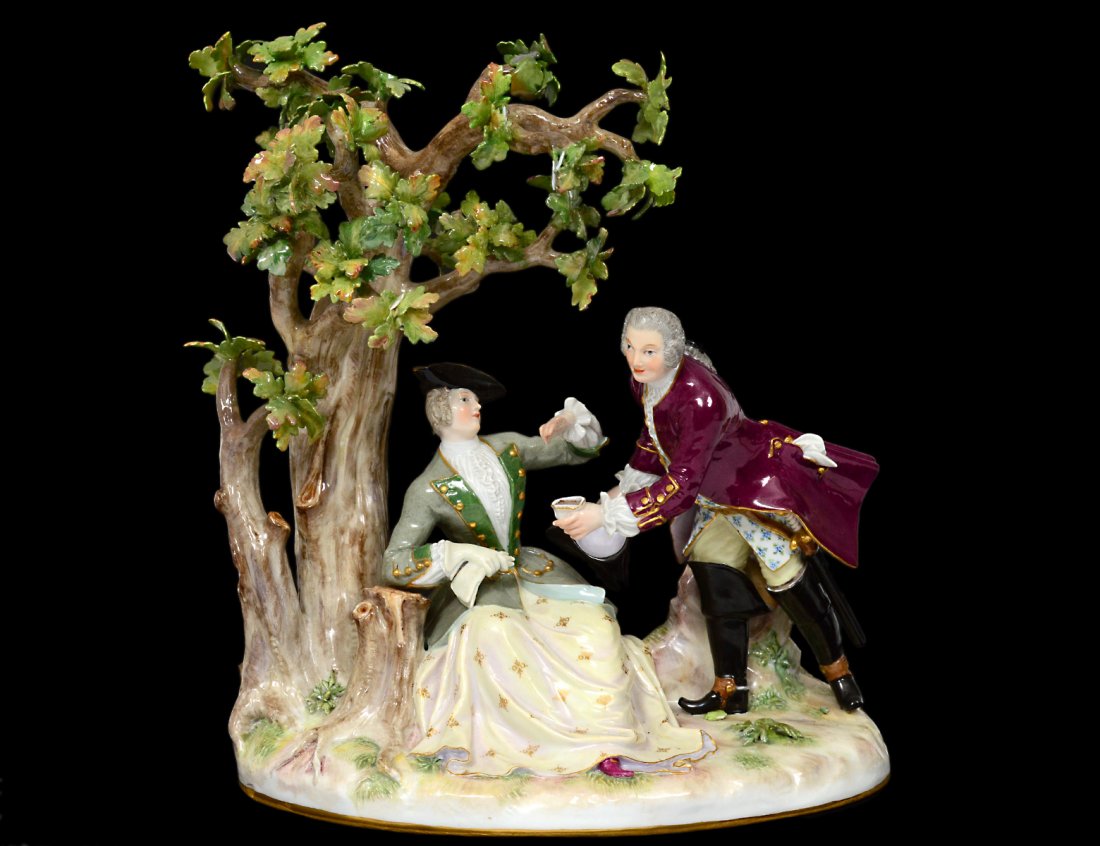 MEISSEN PORCELAIN GROUP: German. Circa 1900. Underglazed blue crossed swords and incised 507. Of a couple under a tree. Height 10 1/2". (Cond: usual chips) (1500/2000)
