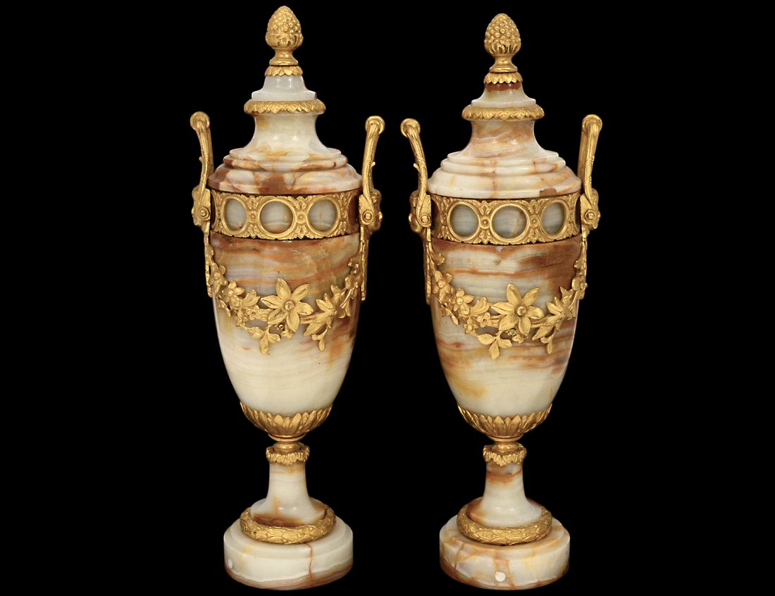 PAIR OF ORMOLU MOUNTED CASSOLETTES: French. 20th Century. Each with upright handles ending in female masks joined by a guilloche border. Height 18". (700/900)