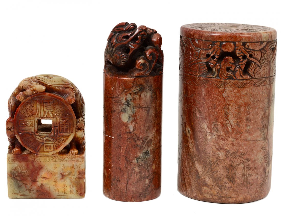 GROUP OF THREE CARVED SOAPSTONE SEALS: Chinese. Comprising: two cylindrical and one sculptural. Height of tallest 5 1/2". (300/400)