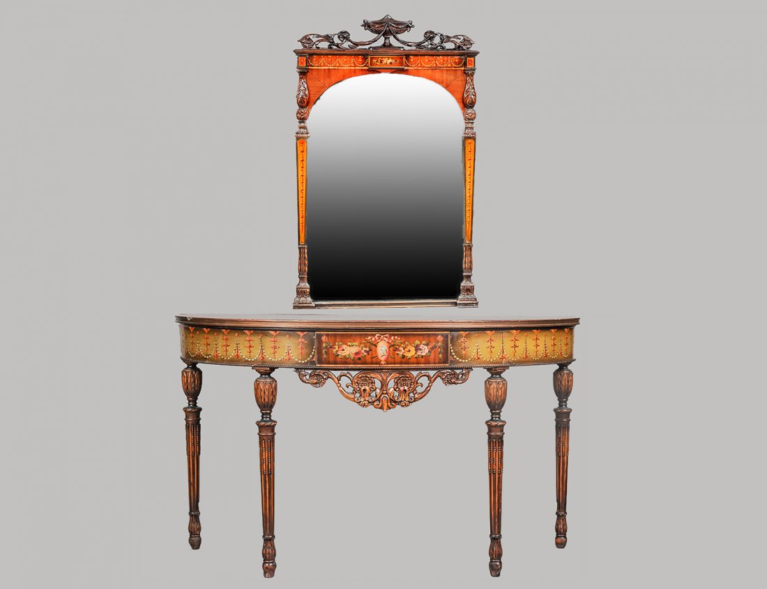 EDWARDIAN PAINTED SATINWOOD CONSOLE TABLE AND MIRROR: English. Circa 1910. The D-shaped console with pierced skirt raised on circular reeded legs, the mirror with arched plate and urn finial. Height of console 31". Width 47 1/8". Depth 18 1/2". Mirror me
