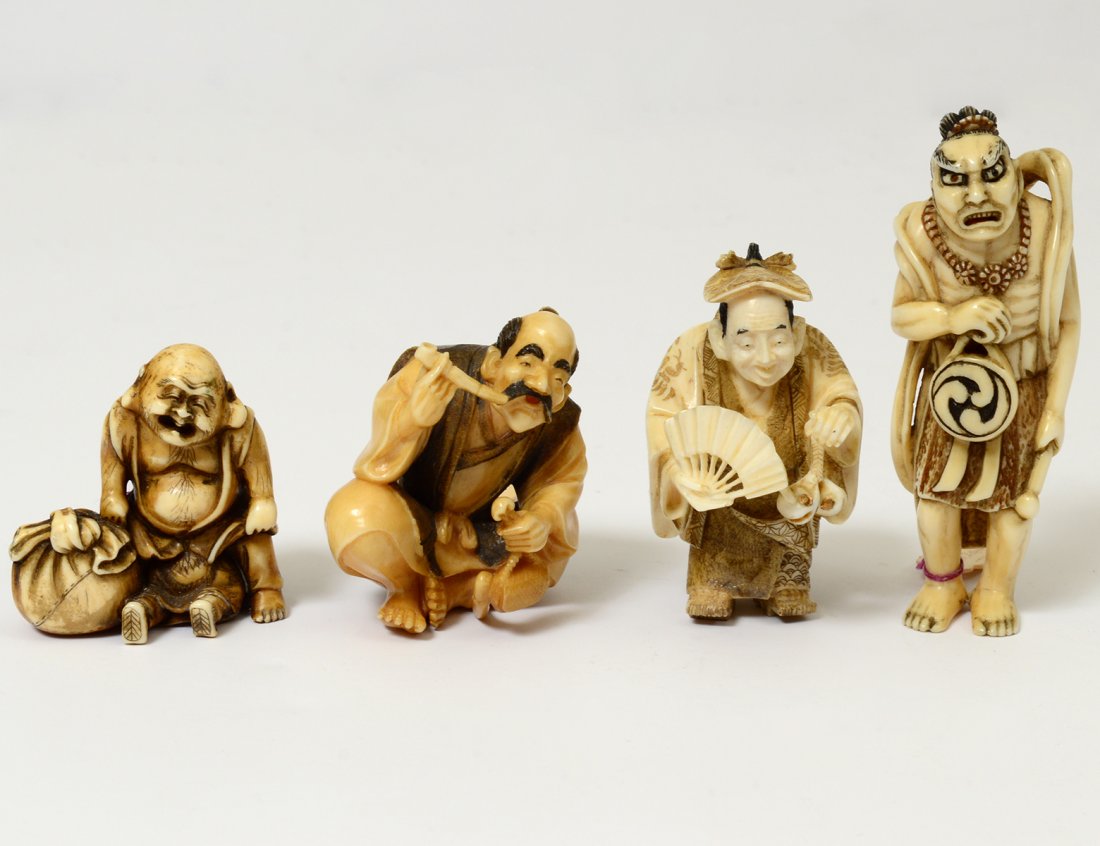 FOUR CARVED IVORY NETSUKES (1 of 7)