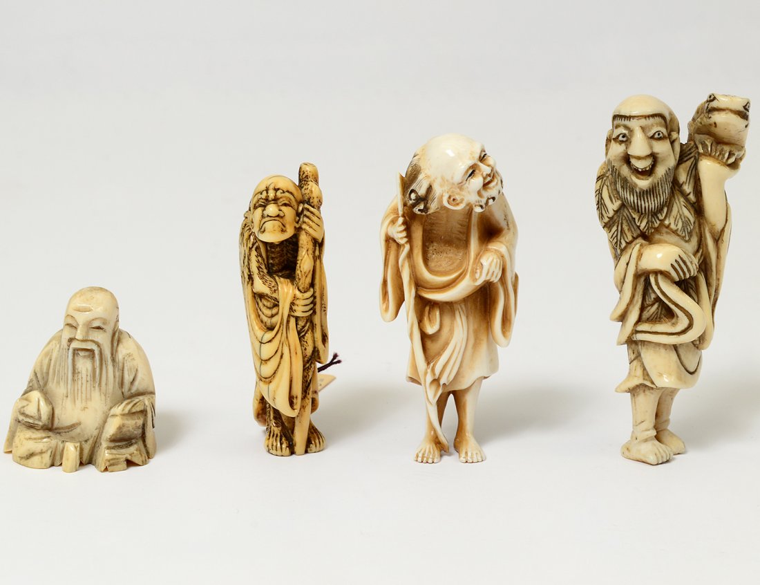FOUR CARVED IVORY NETSUKES (1 of 5)