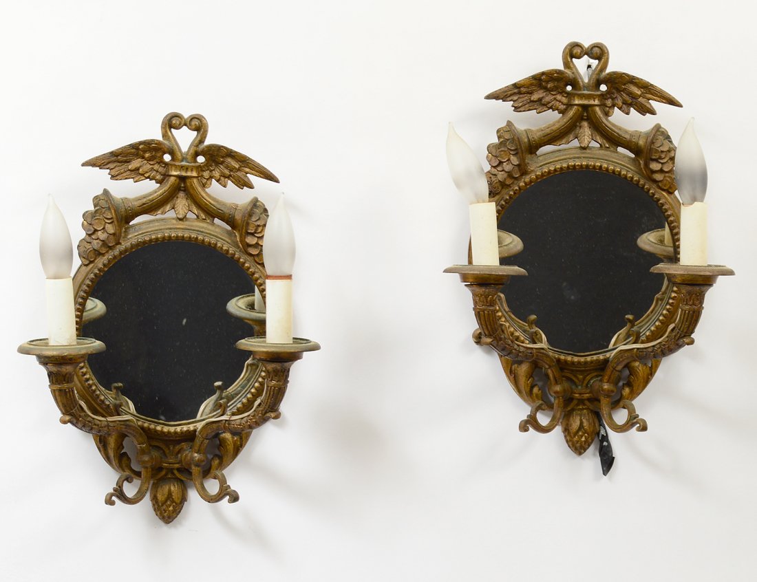 PAIR OF EMPIRE STYLE GILT BRONZE TWO LIGHT MIRRORED: Each with cornucopia and wings finial. Height 13 3/8". (200/300)