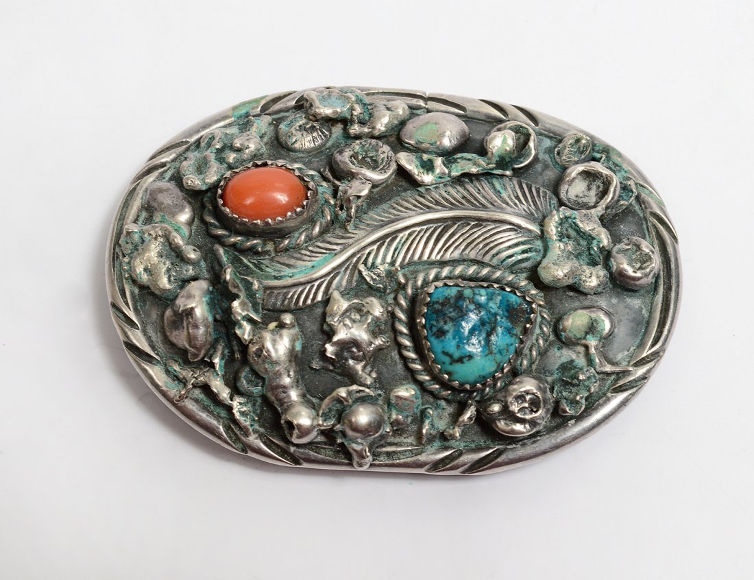 NATIVE AMERICAN STERLING SILVER BUCKLE: Signed Samuel Lee. With one blue turquoise and one coral cabochon and applique of feather and silver nuggets. (Cond: some green oxidation to metal) (250/300)