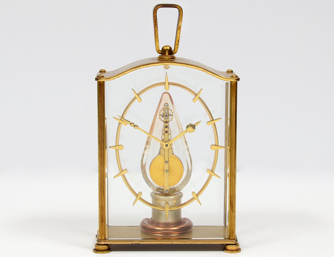 LE COULTRE BRASS AND GLASS DESK CLOCK: Swiss. 16 jewels. Case No. 354. Height 6 3/8". (300/400)