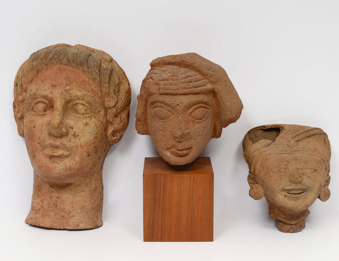 GROUP OF THREE STONE HEADS (1 of 7)