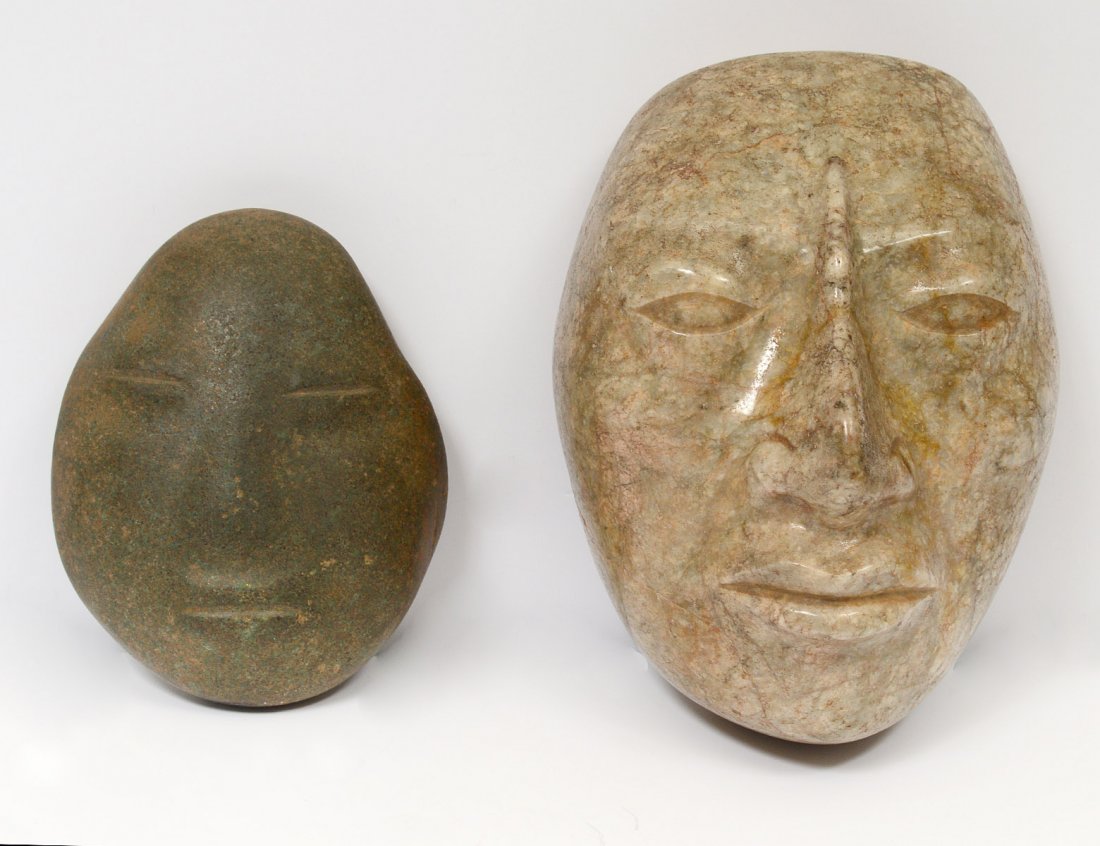 TWO CARVED STONE MASKS (1 of 3)