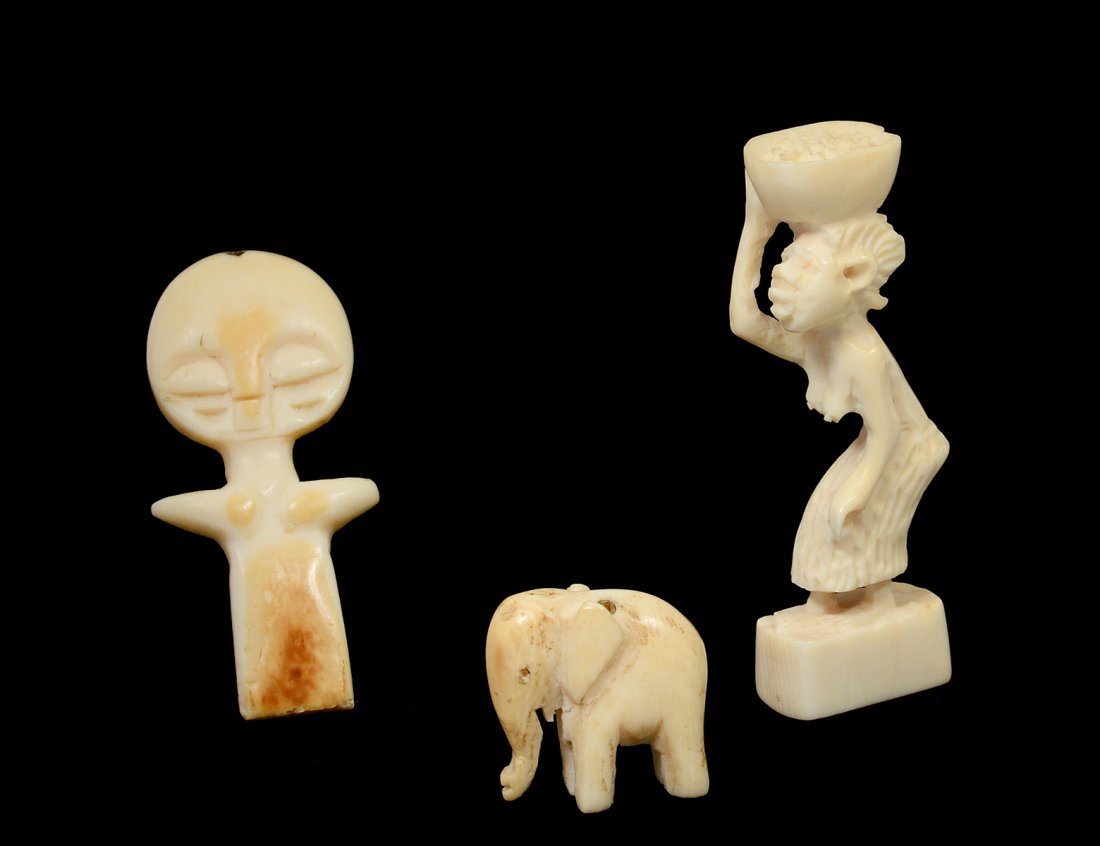 GROUP OF THREE TRIBAL CARVED IVORY STUDIES (1 of 3)