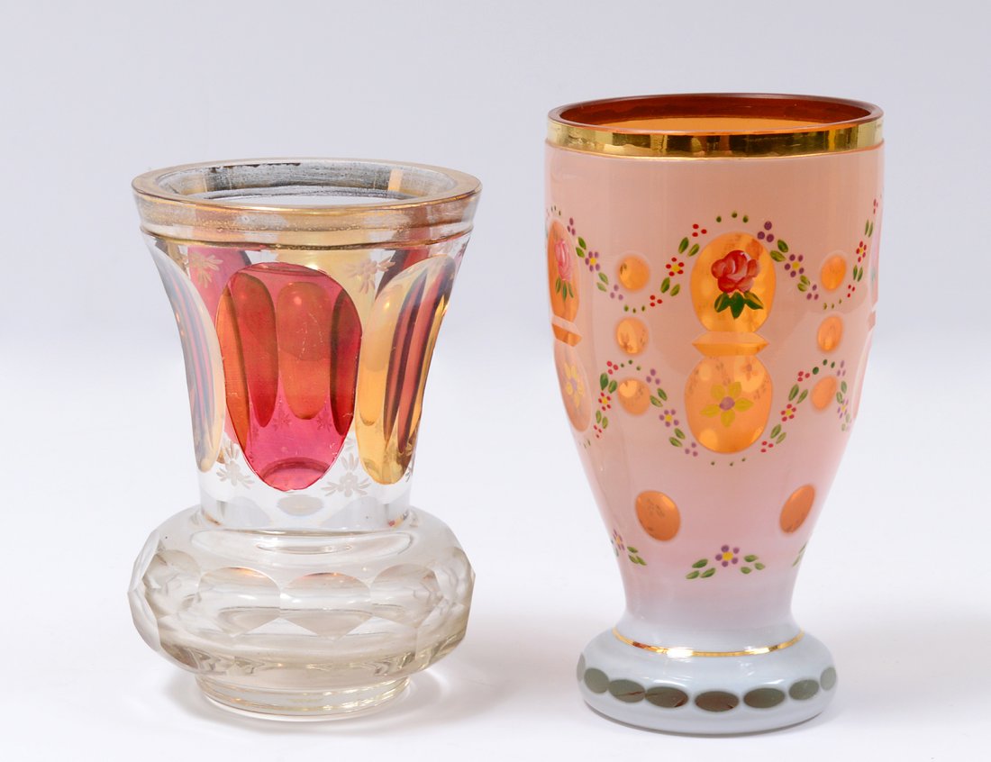 TWO CUT-TO-CLEAR GLASS BEAKERS: The tallest with sticker for Griffe Montenapoleone Milano. Height of tallest 5 7/8”. (Cond: wear to gilding on both) (50/500)