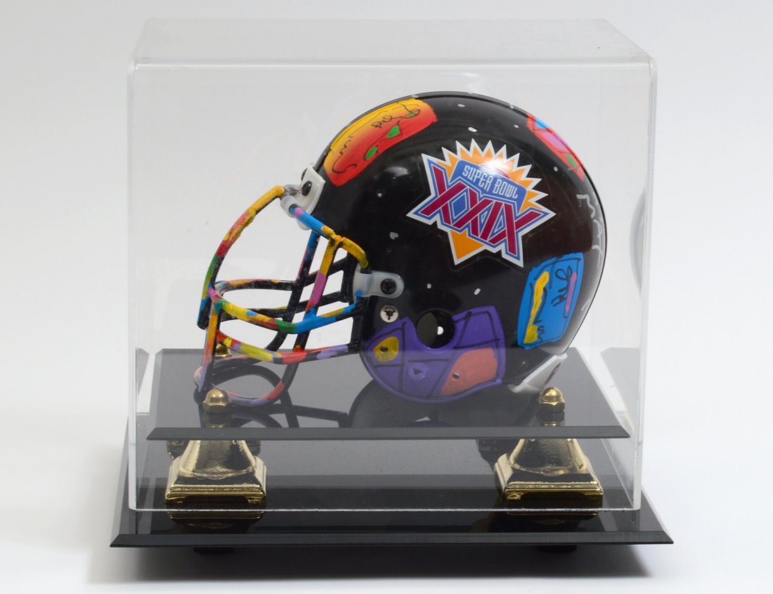 PETER MAX PAINTED MINIATURE FOOTBALL HELMET: "Super Bowl XXIX". Signed Max and dated '95. In a Plexiglas case. (1000/1500)