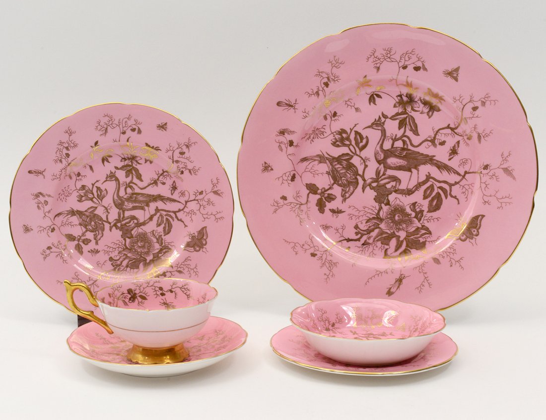 SIXTY-NINE PIECE COALPORT PORCELAIN PART DINNER SERVICE: English. In the "Cairo" pattern. Comprising: twelve dinner plates, twelve salad plates, twelve bread and butter plates, eleven berry bowls and eleven cups and saucers. (700/1000)