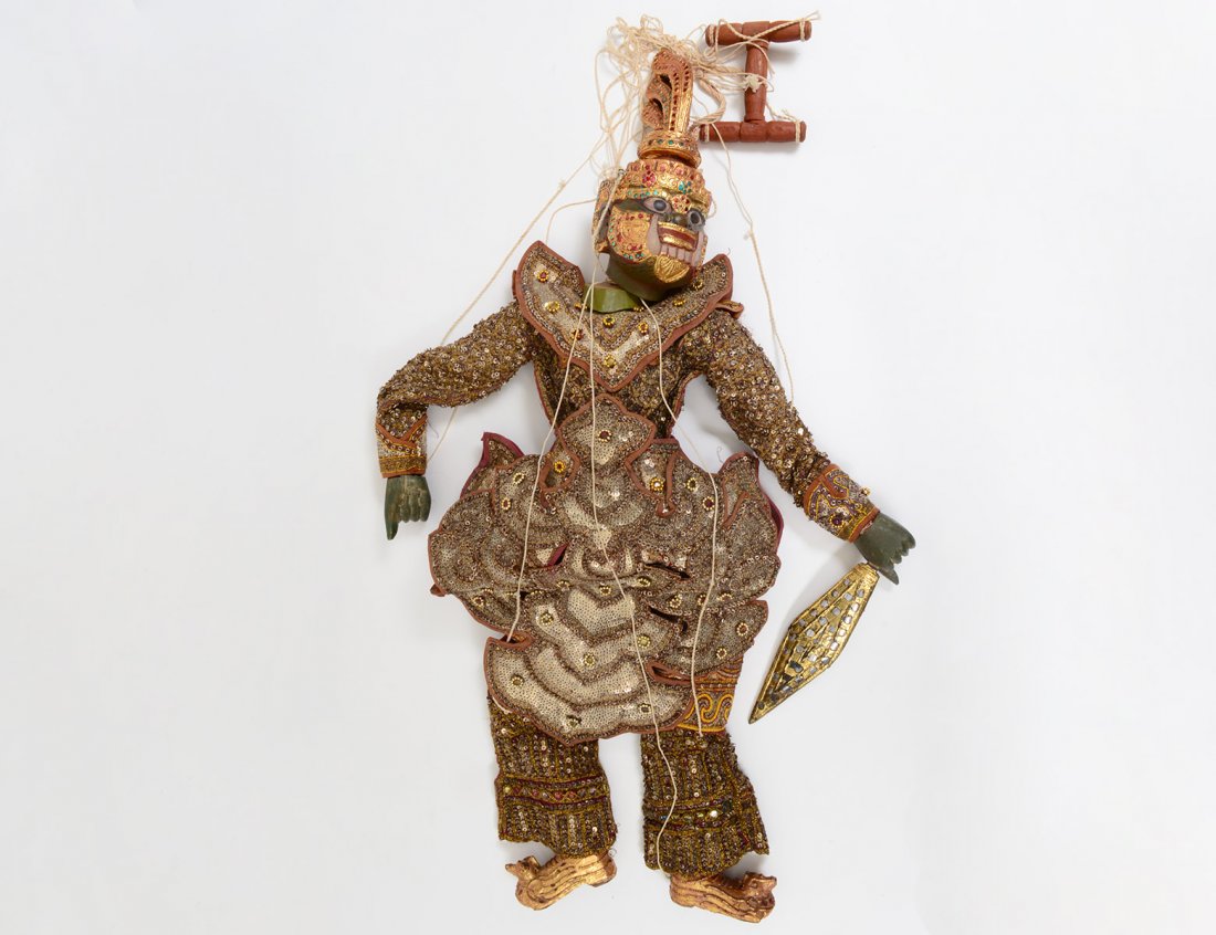 INDONESIAN PUPPET: With carved and gilt wood head, feet and hands. Height 35 1/2". (150/200)