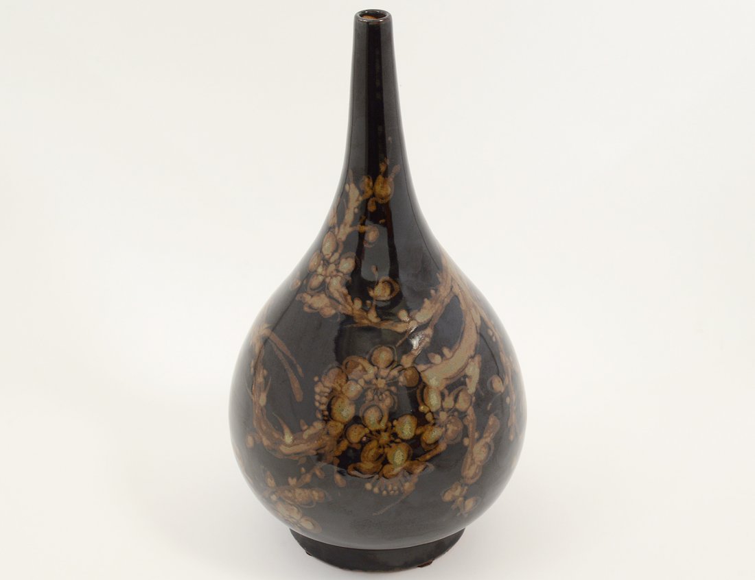 PORCELAIN VASE: Japanese. 20th Century. Signed on the shoulder. Of bottle form decorated with foliage. Height 15". (300/400)