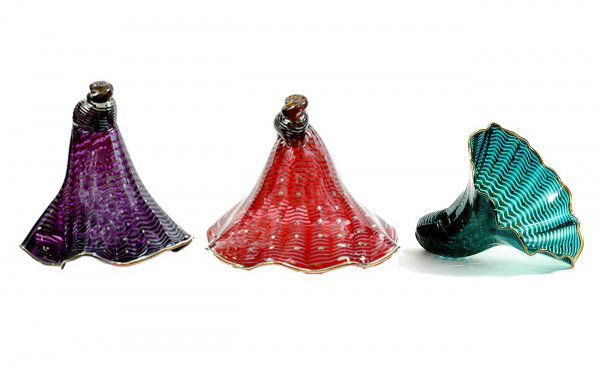 Three Gwen Knight Hand Blown Large Glass Sea Shell: Three Gwen Knight Hand Blown Large Glass Sea Shells accented with Sterling Silver. Iridescent Ribbon Form One in Blue Measures 10-1/2 Inches Wide 9 Inches Tall, One Pink Measures 10-1/2 Inches Tall 13