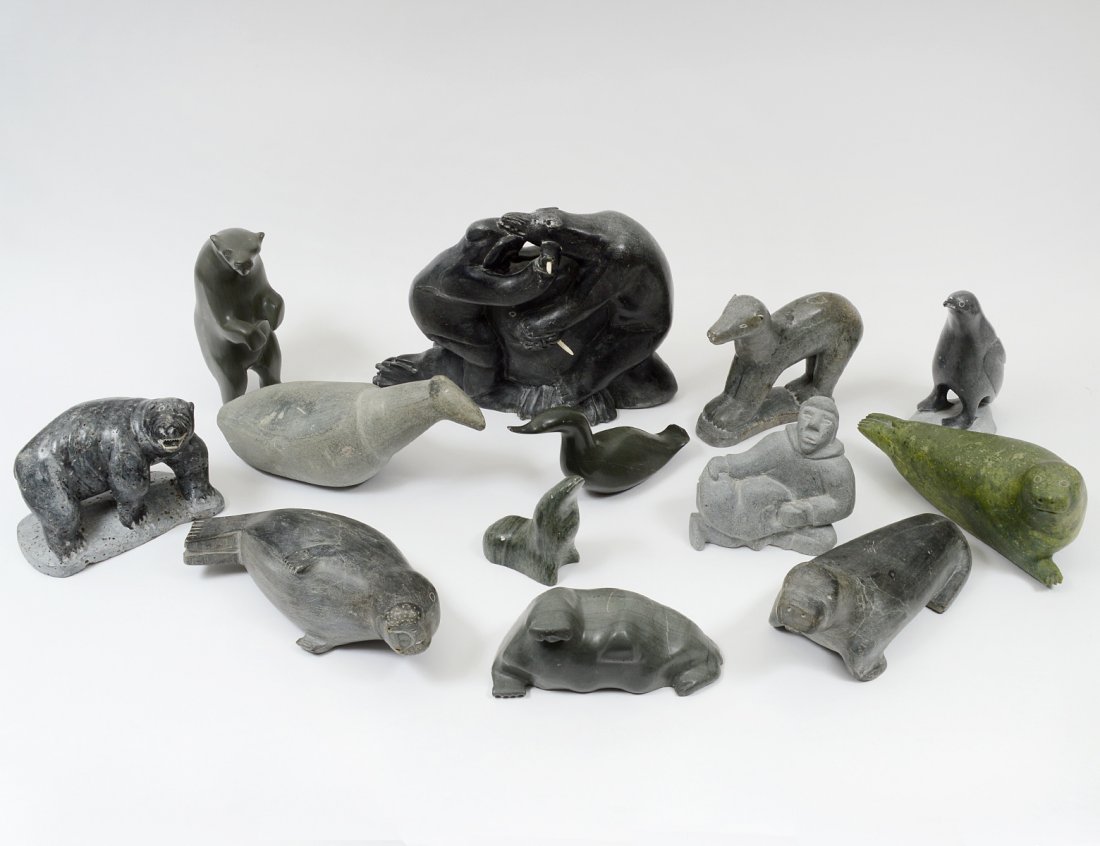 GROUP OF THIRTEEN NATIVE INUIT STONE CARVINGS: Comprising: Walrus by Jolmosie, Community Belcher; Figure of Man by Takulits; Seal by Whale Cove Community; Seal by Lizzie Tookaluk #32831; Bear by Samson #E9712; Bear by Johnney Poxungnituk Community
