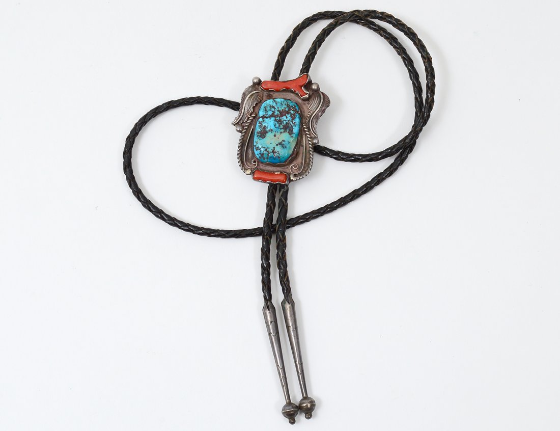 NATIVE AMERICAN STERLING SILVER TURQUOISE AND CORAL: Signed JWC. Bennett slide mechanism. Set with one blue turquoise black matrix cabochon and two coral branch pieces. Appliques of balls, feathers, rope and swirls. Stampwork on tips. (1.38 ozt) (Cond: 