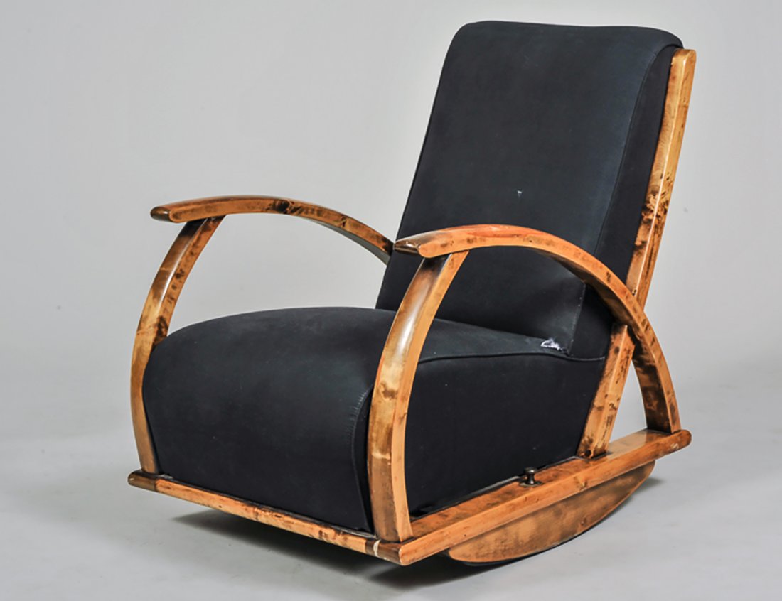 ART DECO DECK ROCKING ARM CHAIR: With upholstered back and seat flanked by open arms. (300/400)
