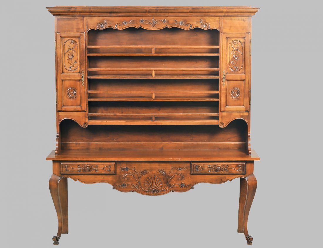 GEORGIAN STYLE FRUITWOOD STEPBACK CUPBOARD: In two parts. The upper with molded pediment above the carved frieze and open shelves flanked by cupboard doors. The lower section with two frieze drawers. Height 80". Width 70 3/4". Depth 17 3/4". (1