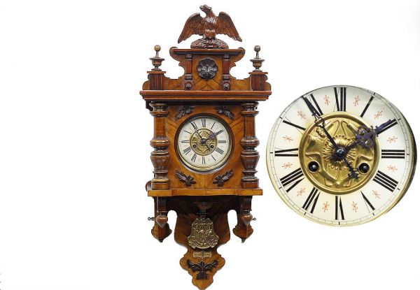 German Antique Free Swinger Walnut Wall Clock: German Antique Free Swinger Walnut Wall Clock Circa 1900 with Detailed Wooden accents, Art Nouveau Floral brass inlay dial, enamel outer dial and with brass pendulum. 38inches high x 14 ¼ inches wide