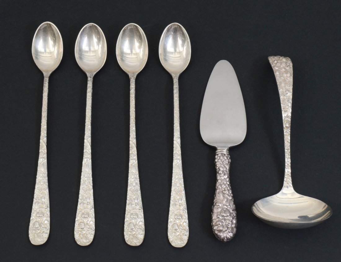 GROUP OF KIRK REPOUSSEE STERLING SILVER ARTICLES: Comprising: a cream ladle, four iced tea spoons and small server. No monogram. Length of longest 7 1/4”. 7.1 troy ounces weighable. (Cond: good) (150/200)