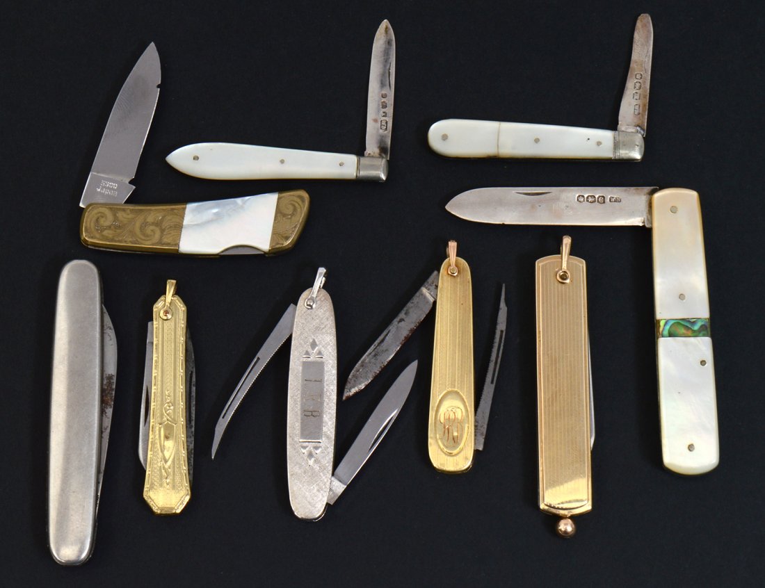 GROUP OF NINE POCKET KNIVES: To include three Sheffield sterling silver mother-of-pearl knives. Three gold filled knives. One gilt metal and mother of pearl knife. Two stainless steel knives. (Cond: signs of wear, scratches, crac