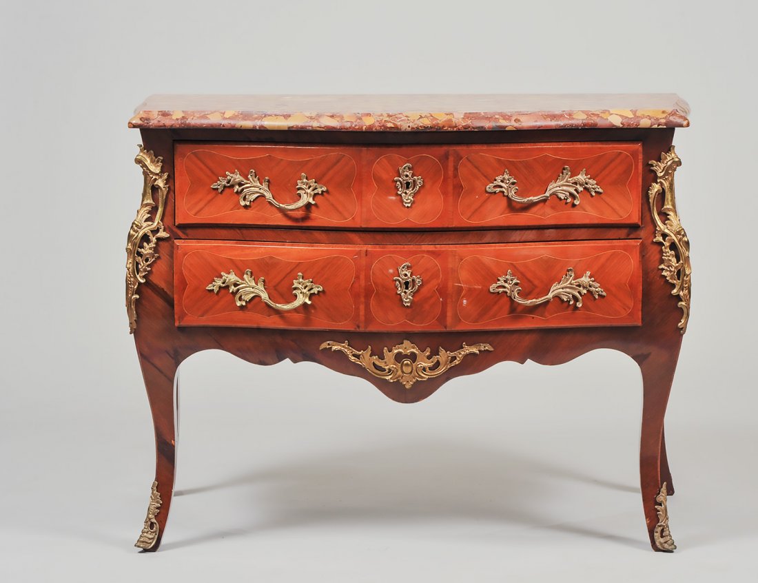LOUIS XV STYLE MARBLE TOP TULIPWOOD COMMODE: Circa 1900. The serpentine breche d'alep marble top above a conformingly shaped case, fitted with two line inlaid drawers, the sides with fruitwood inlaid floral sprays, on cabriole legs; with gilt br