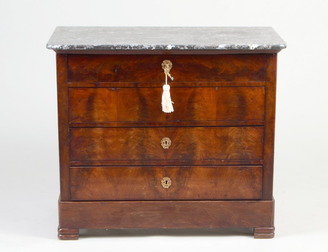 LOUIS PHILIPPE MAHOGANY COMMODE: French. Circa 1880. With marble top above four long drawers, raised on block feet. Height 34". Width 39". Depth 19 3/4". (500/600)