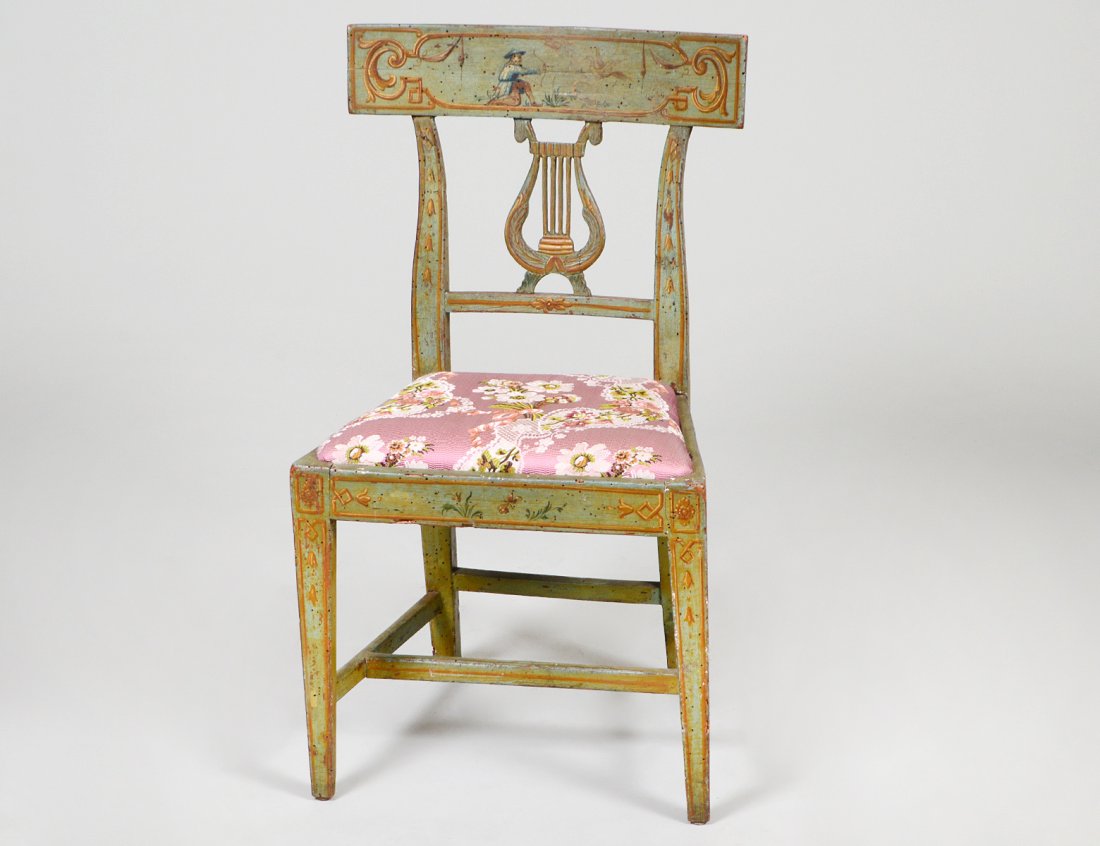 NEO-CLASS CHINOISERIE PAINTED LYRE-BACK SIDE CHAIR: Italian. Circa 1790. The crest rail depicting a Chinese hunter within a border of gilt scrolls, the seat rails and straight legs, decorated with trophies and foliage. (Cond: worm damage throughout, ce