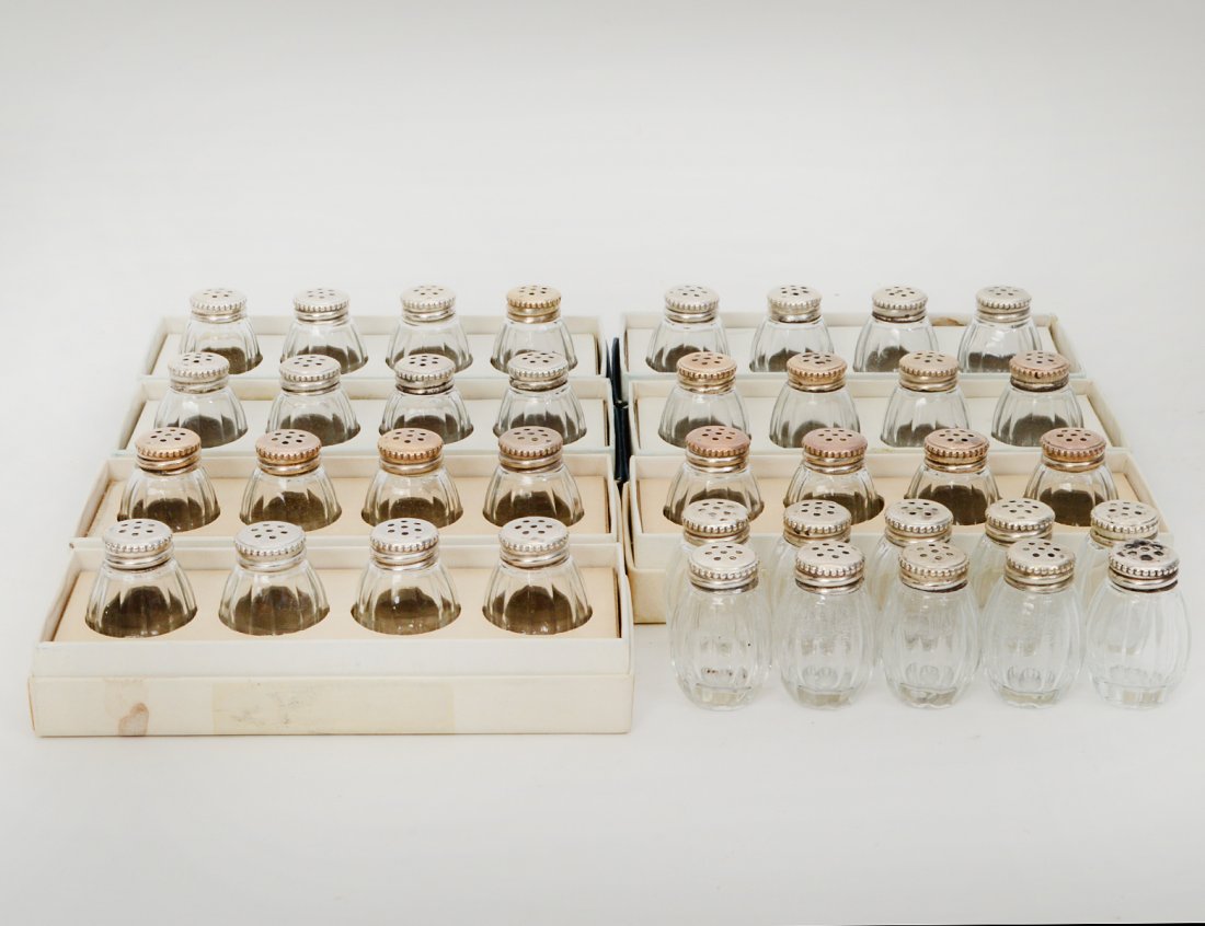 NINETEEN PAIRS OF INDIVIDUAL SALT AND PEPPERS: Marked Christofle. All but five pairs in original fitted boxes. (Cond: some wear to metal) (100/150)