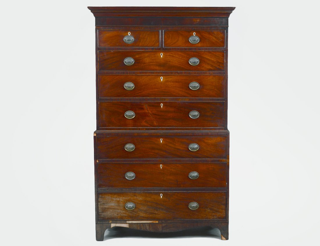 GEORGE III MAHOGANY CHEST ON CHEST: Circa 1780. The molded cornice over an arrangement of drawers, on flared feet. Height 6'5". Width 47". Depth 22". (Cond: good color, some humidity discoloring to right side lower drawer, losses, loss 