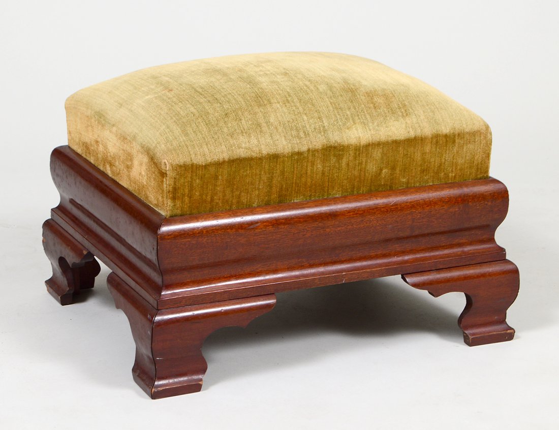 AMERICAN RESTORATION MAHOGANY FOOT STOOL: Circa 1840, with a drop-in seat with ogee scrolled base and feet. Height 16”. Width 23 ½”. Depth 18”. (Cond: minor losses to edges on some feet) (100/150)