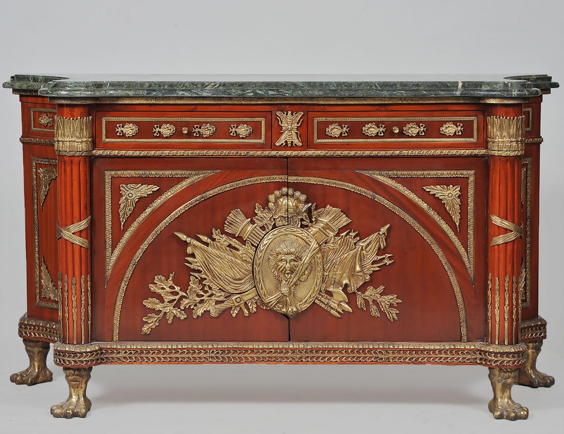 LOUIS XVI STYLE MARBLE TOP MAHOGANY COMMODE: Modern. After a design by Benneman. The shaped rectangular top above a conforming case with concave sides, fitted with two drawers over two doors, flanked by projecting reeded columns; the doors with 