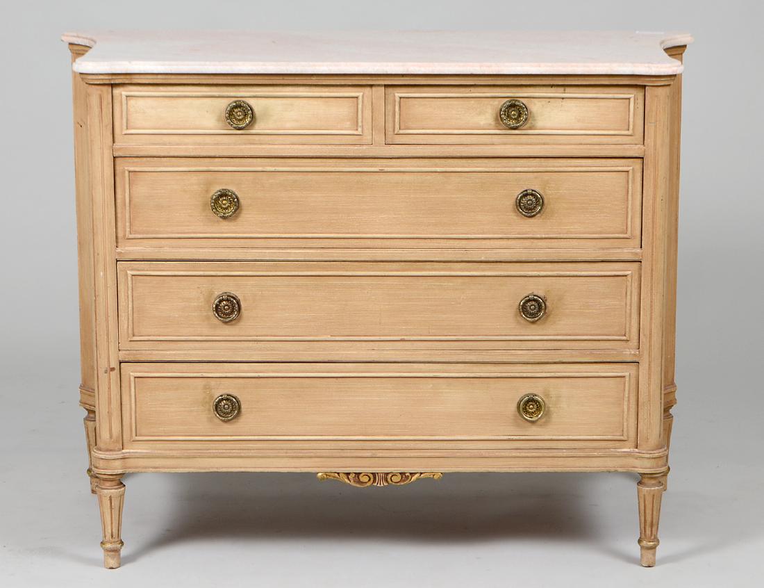 LOUIS XVI STYLE MARBLE TOP BLEACHED COMMODE: 20th Century. The shaped rectangular marble top with rounded front corners and concave sides above a conforming the body fitted with drawers, on circular tapered fluted legs, with gilt moldings. Heigh