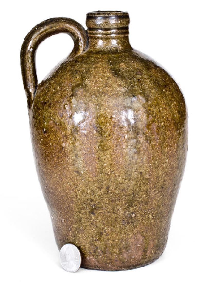 Rare David Hartzog ("DH"), Vale, Lincoln County, NC: Rare Small-Sized Stoneware Jug with Alkaline Glaze, Stamped "DH", David Hartzog, Vale, NC, circa 1840, ovoid jug with finely-tooled spout and ribbed handle, the surface covered in a mottled olive-gree