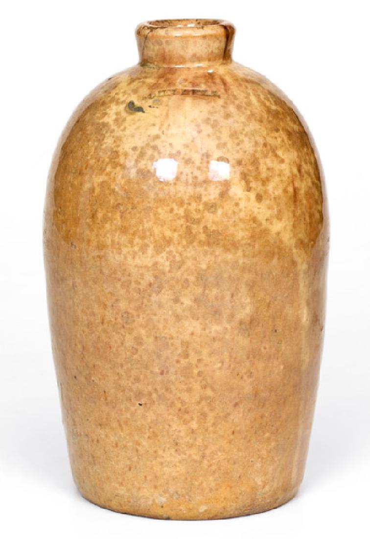 JOHN BELL (Waynesboro, PA) Redware Jug: Glazed Redware Jug, Stamped "JOHN BELL", Waynesboro, PA origin, circa 1840-1880, approximately one-half gallon ovoid jug, the surface covered in a clear lead glaze over a mottled yellowish ground. Ver