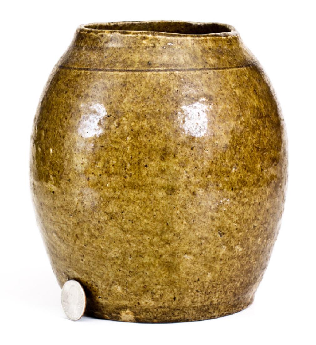 Unusual Crawford County, Georgia Stoneware Spice Jar: Rare Alkaline-Glazed Stoneware Spice Jar, Crawford County, GA origin, late 19th or early 20th century, ovoid jar with tooled shoulder, the surface covered in an olive-green alkaline glaze. The atypica