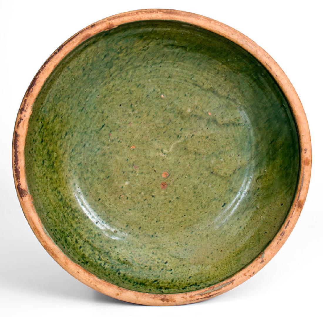 Mottled Green New England Redware Bowl: Copper-Glazed Redware Bowl, New England origin, early to mid 19th century, flared pan with semi-rounded rim, the interior covered in an attractive lead-and-copper glaze. Some small flakes to interior.
