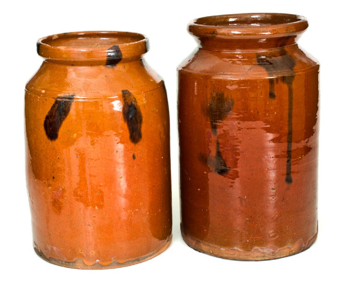 Lot of Two: Norwalk, CT Redware Jars with Manganese: Two Glazed Redware Jars, Norwalk, CT origin, circa 1840, both of cylindrical form with tooled shoulders and semi-rounded rims, decorated with manganese daubs under a clear lead glaze. Slightly-taller